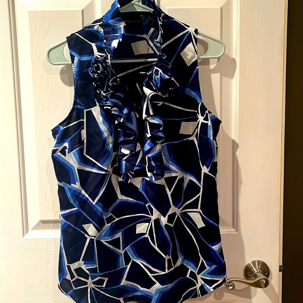 NY&co sleeveless ruffled neck blouse.  Geometric print  blues & white size 12